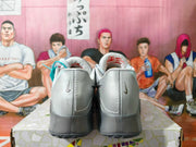 Nike Gray Low-Top Sneakers with Metallic Swoosh