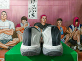 Nike Basketball Sneakers in Gray and White with Orange Swoosh